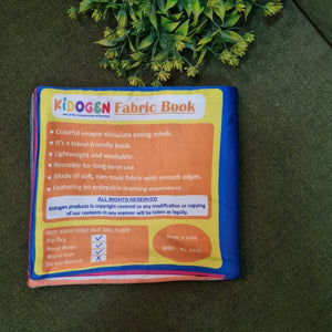 "Flag of the World" fabric book by Kidogen, displaying pages about India, USA, Italy, and the United Kingdom with their flags, landmarks, and descriptive rhymes.