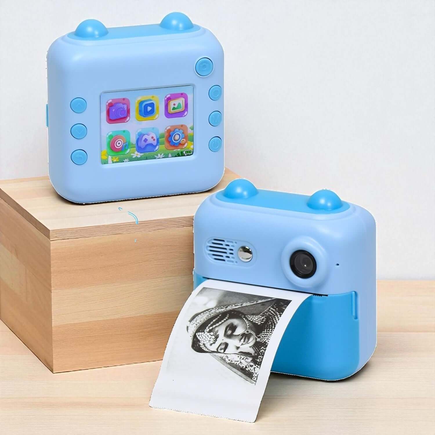 Children's HD Digital Print Camera FS14 in light blue, featuring instant photo printing. The image shows the camera alongside its retail box, ideal for young photographers. www.usmile.toys