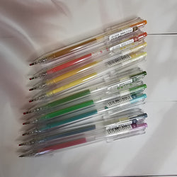 Set of 9 Assorted Color Gel Pens: Includes a variety of vibrant and muted ink colors for creative projects. Smooth flow pens.
