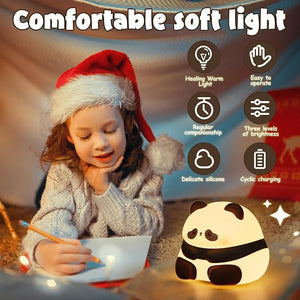 Adorable glowing white and black silicone night lamp for kids, shaped like a baby sitting panda with a sweet expression. Provides a soft, comforting light for bedrooms from uSmile.toys www.usmile.toys