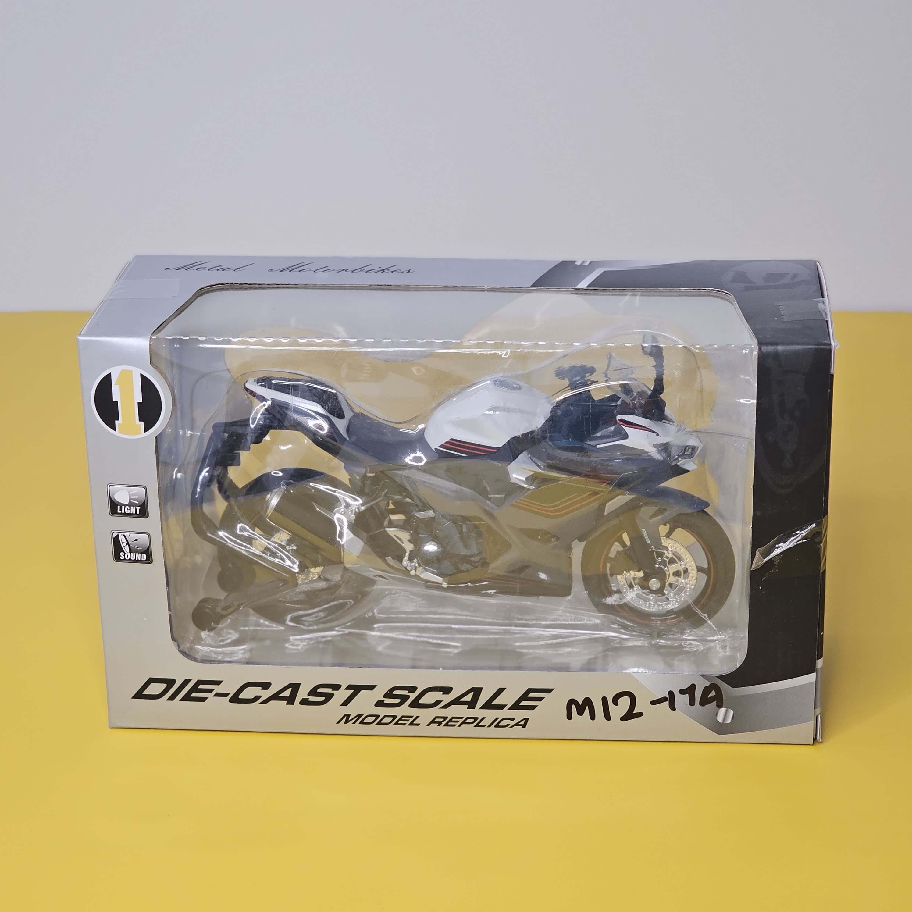 Close-up front view of a vibrant green and black toy motorbike, a die-cast model designed for kids with interactive LED lights and fun pull-back action, available at Usmile Toys.www.usmile.toys