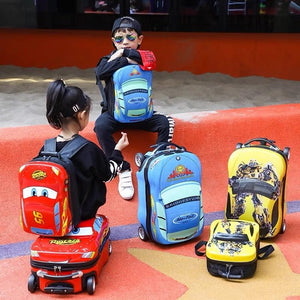 Durable blue 18-inch boys' travel luggage with car design and extendable handle, ideal for young travelers.