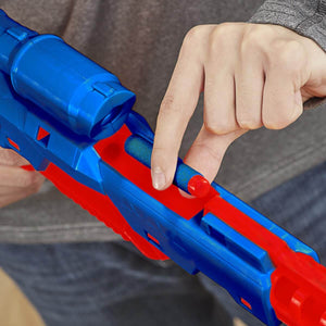 Red and blue toy gun with a person's hand holding it, blurred background