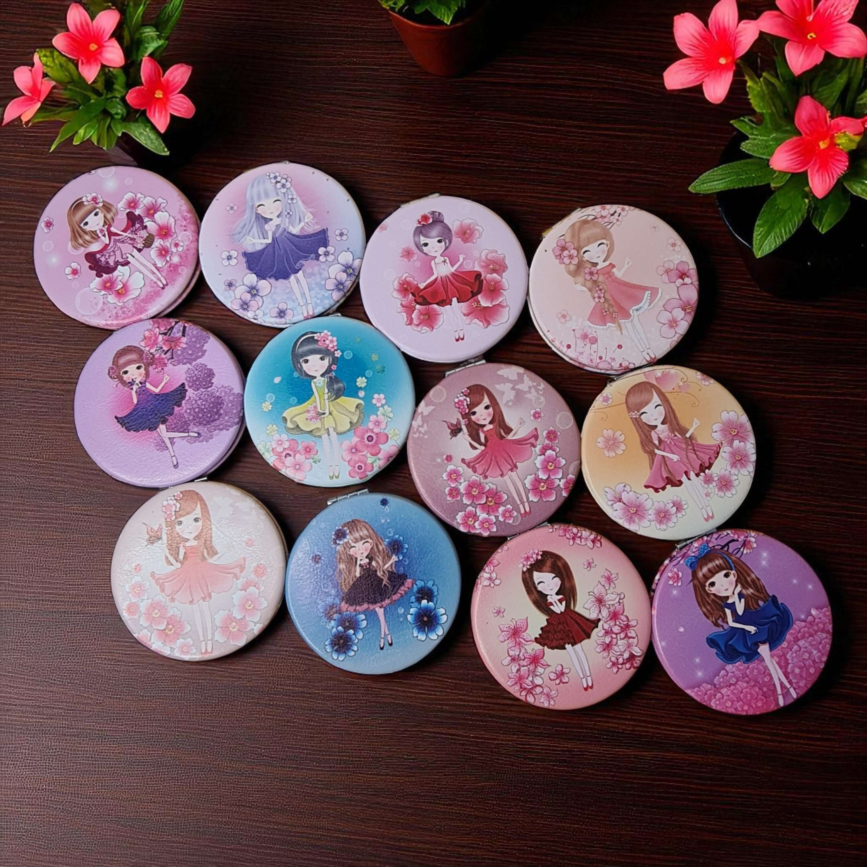 Set of round coasters with cartoon character designs on a wooden surface with flowers.