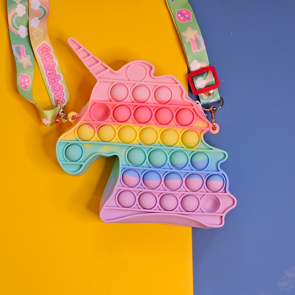 Unicorn Pop It Purse set, a delightful combination of a trendy sensory toy and a cute accessory, perfect for little unicorn lovers! This set, likely featured on www.usmile.toys for its fun