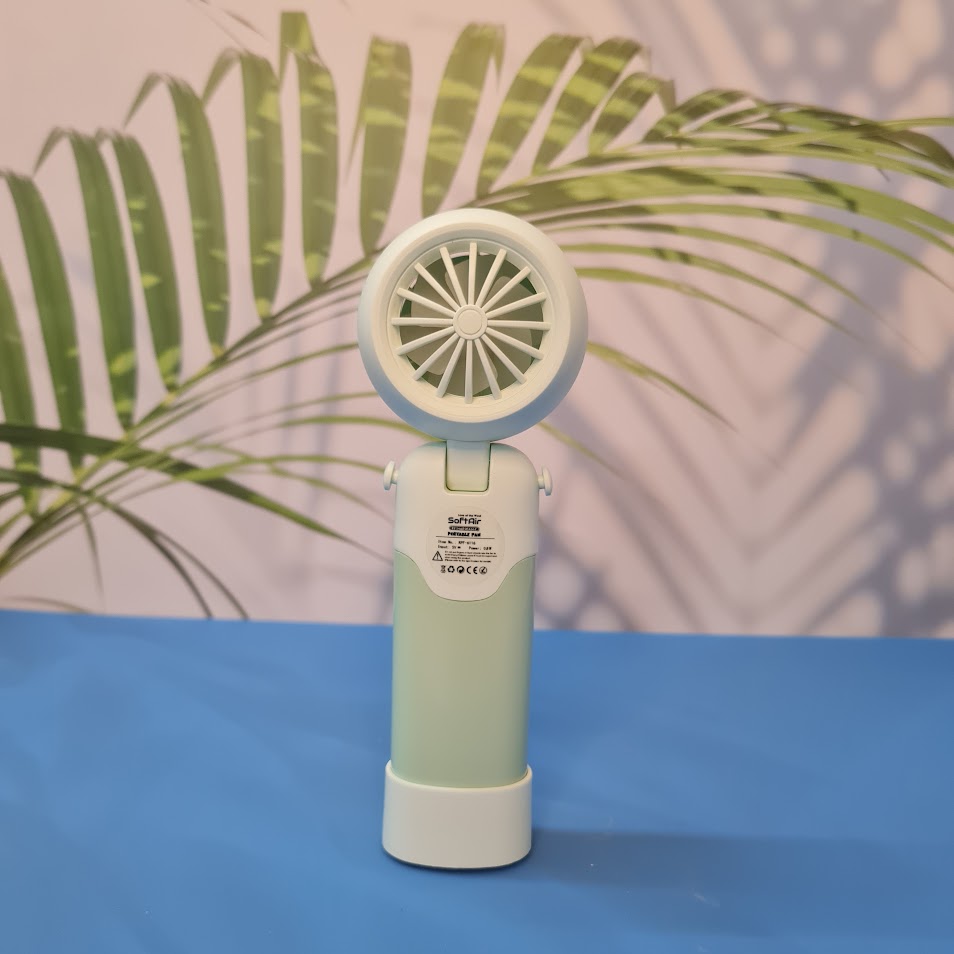 Colorful collection of portable bladeless mini fans for kids in pastel pink, green, blue with bear ears, and cream, designed with a child-safe bladeless head and single-button operation. These rechargeable USB fans are ideal for travel, school desks, or bedtime comfort, offering quiet and efficient cooling in a cute, compact design. Perfect return gift or utility item for children, available at U Smile Toys online store