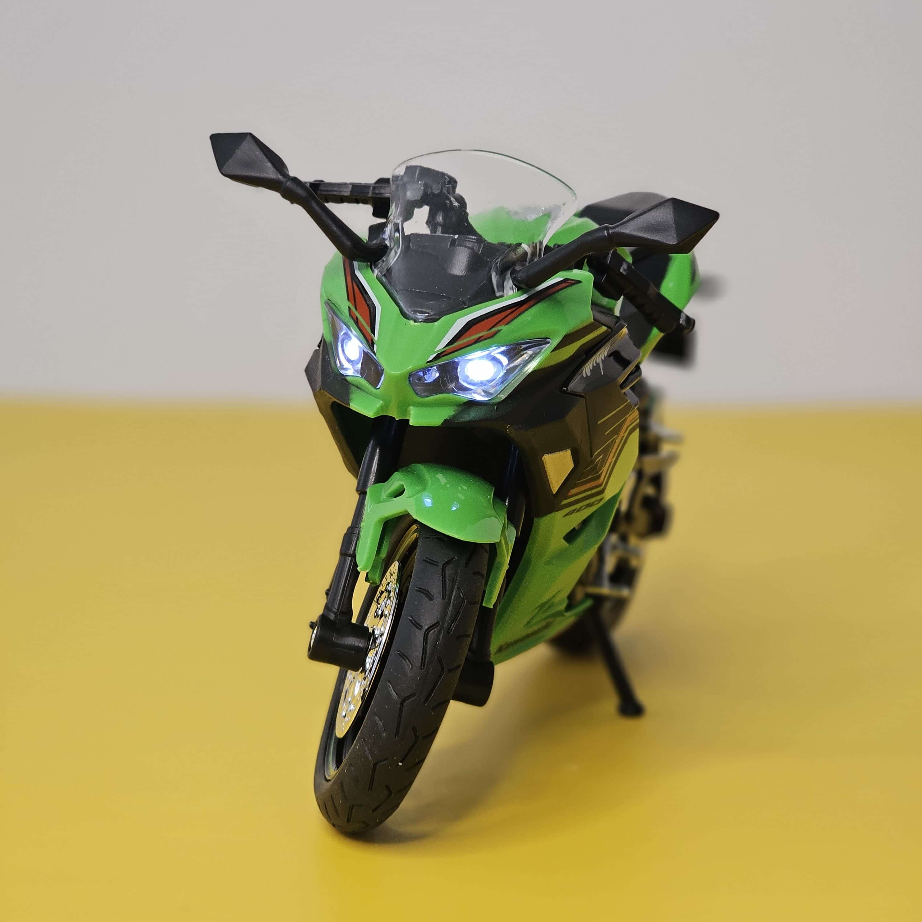 Vibrant green die-cast Kawasaki Ninja sports bike toy with black accents, featuring pull-back action and LED lights, perfect for kids' playtime from Usmile Toys.