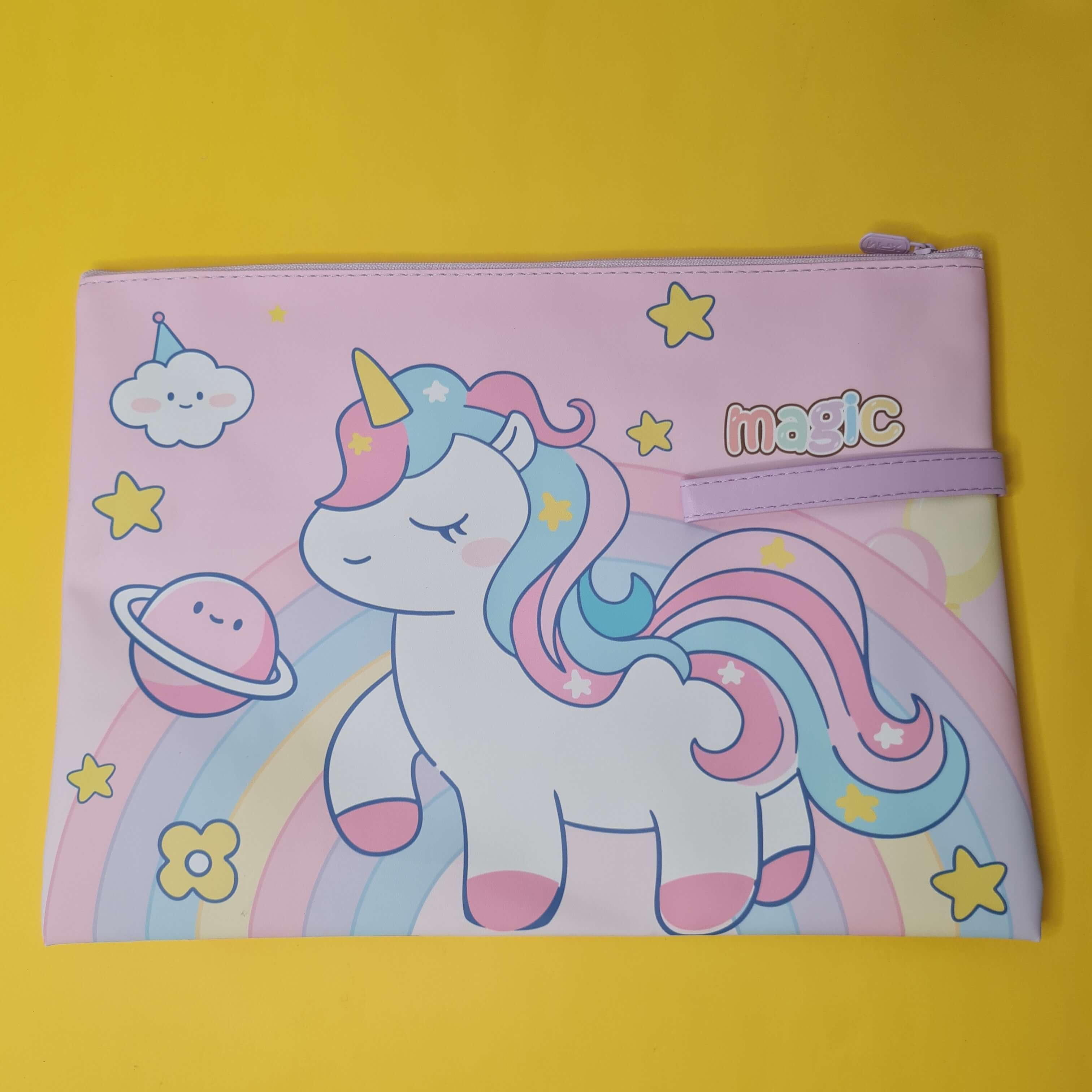 Pink pouch with a unicorn design on a yellow background
