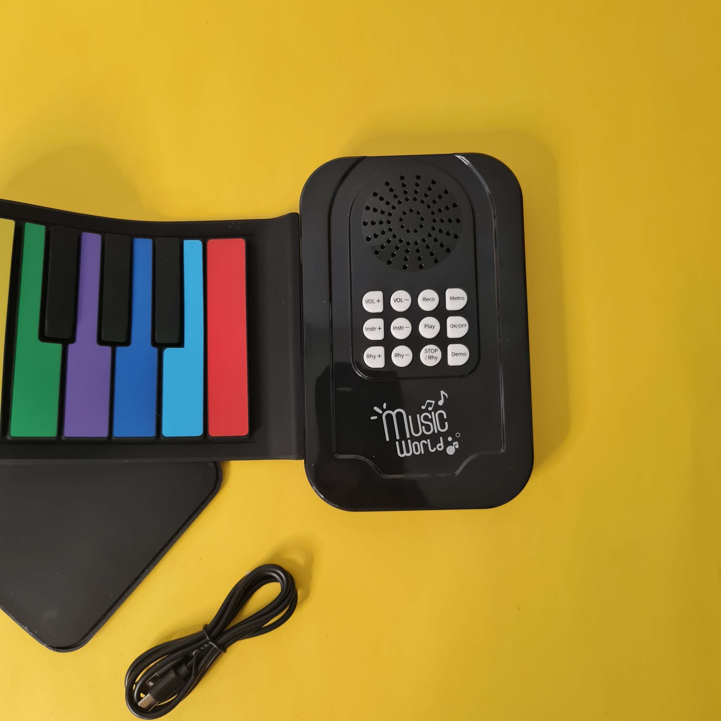 Image showing a 25-key silicone foldable hand roll piano, an electronic music toy perfect for children's learning and portable entertainment from U Smile Toys." www.usmile.toys