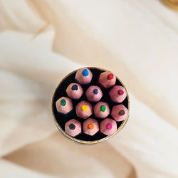 Assortment of 12 bright, kid-friendly pencil colors in a convenient tube packaging, promoting artistic fun and learning for kids, available at uSmile.toys www.usmile.com