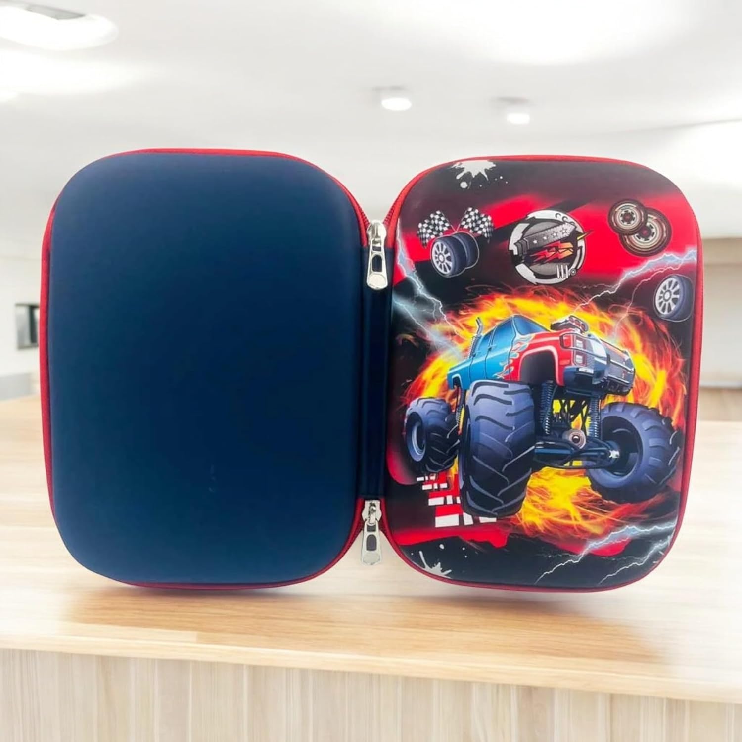 Store school supplies in style with this large, durable silicone pencil case for boys, showcasing an exciting monster truck and flame design. Perfect for young adventurers from uSmile.toys."