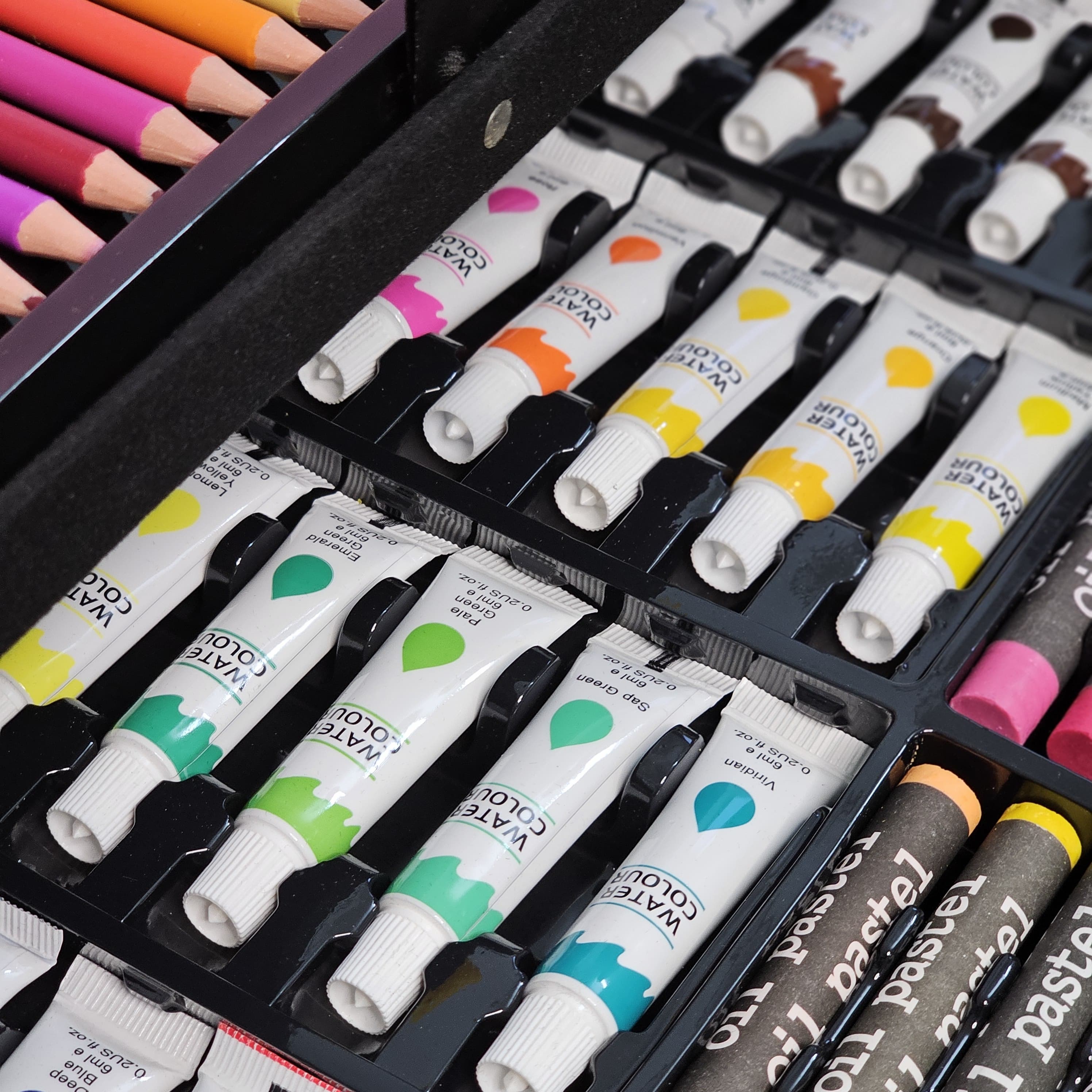 Kids' unicorn art set with markers, crayons, paints, and brushes. Portable art supplies for children, available at usmile.toys