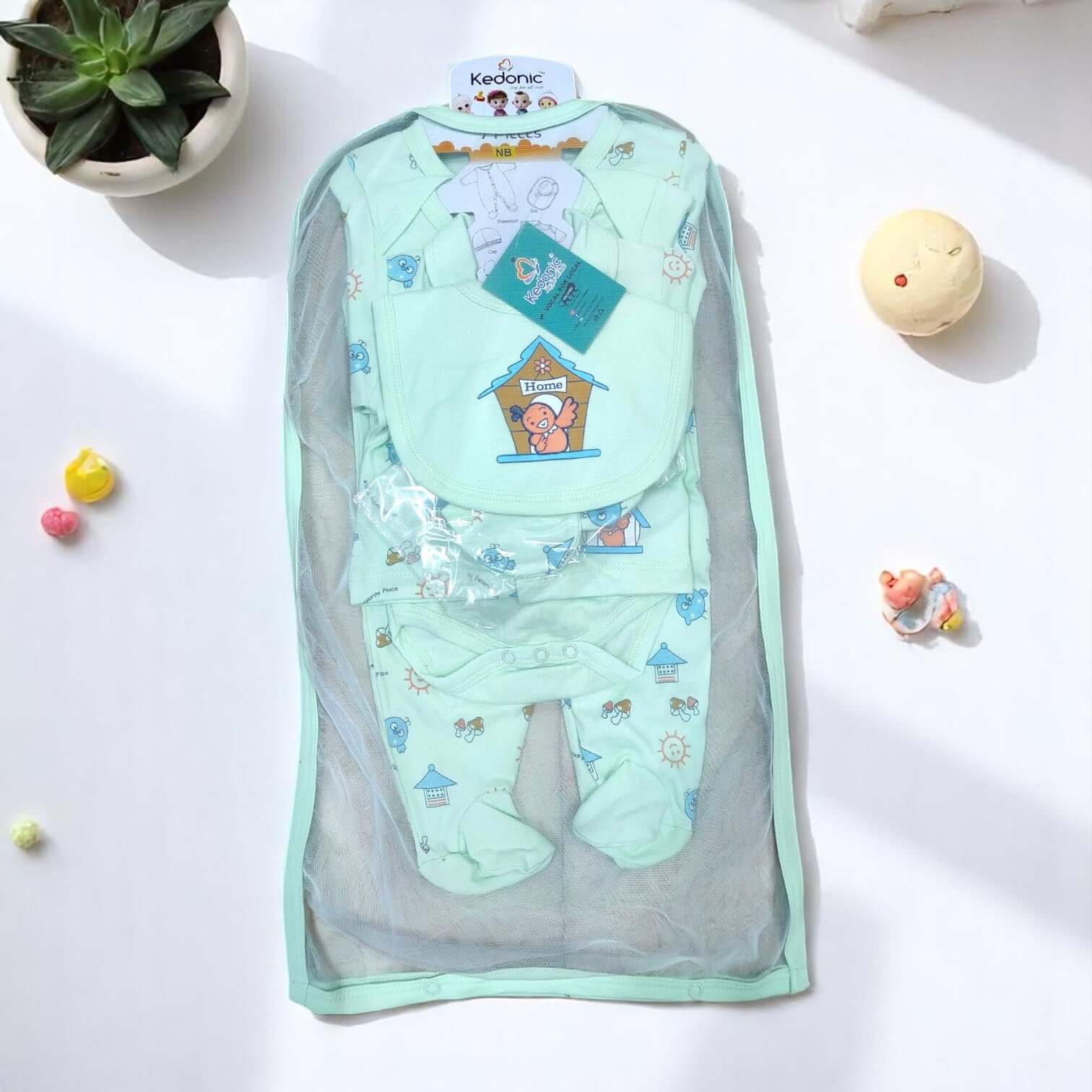 "Full view of a 7-piece newborn baby clothing set, featuring a grey and white dinosaur print, including bodysuits, pants, bib, and cap, available at uSmile.toys.www.usmile.toys