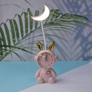 The perfect gift for kids or nursery decor: Usmile Toys cute pink bunny alarm clock with a gentle moon night light. This charming timepiece helps little ones learn to tell time while offering comforting bedtime lighting." www.usmille.toys