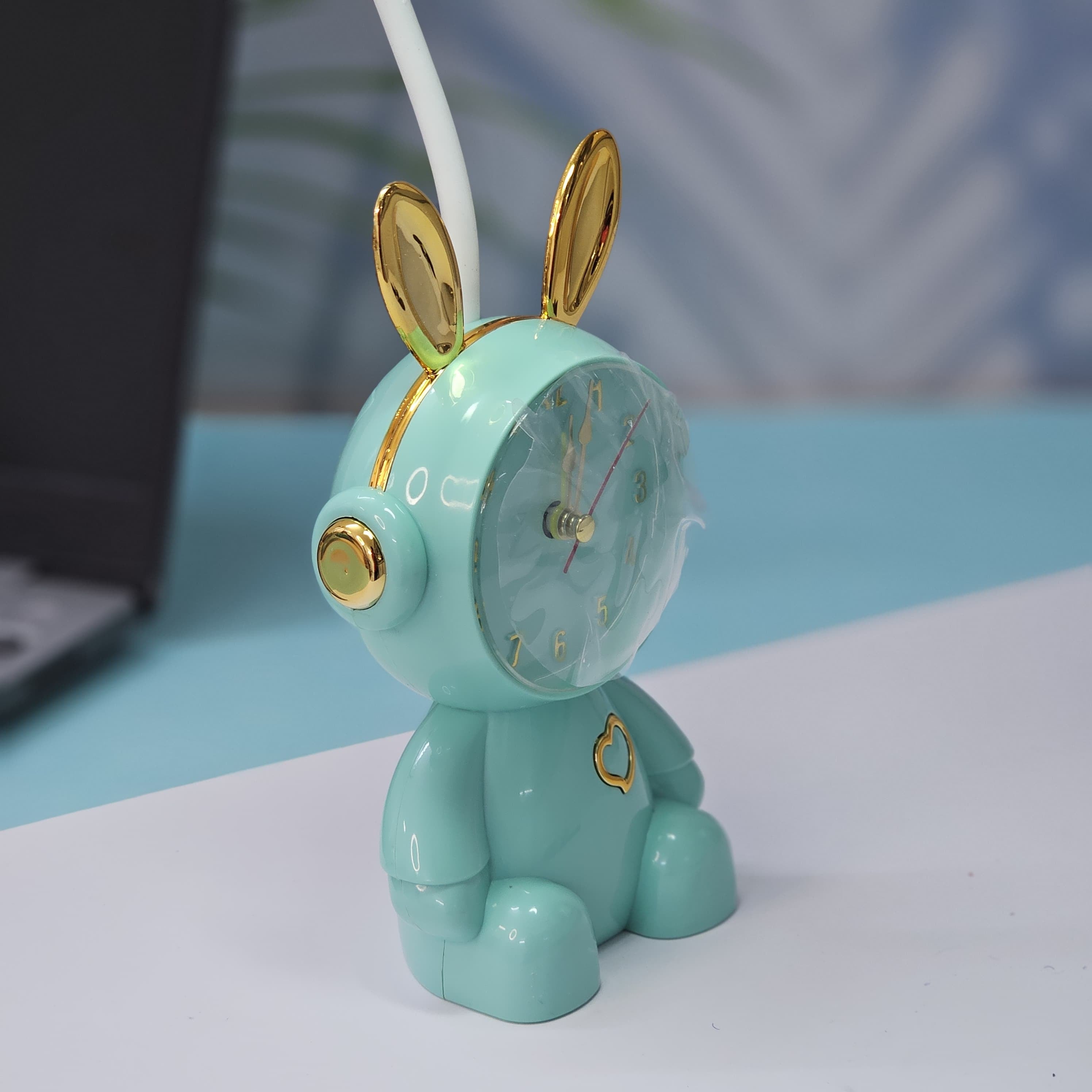 Buy the Usmile Toys adorable pink bunny clock with moon night light for your child's room. This fun alarm clock and soft lamp helps create a soothing bedtime routine."www.usmille.toys