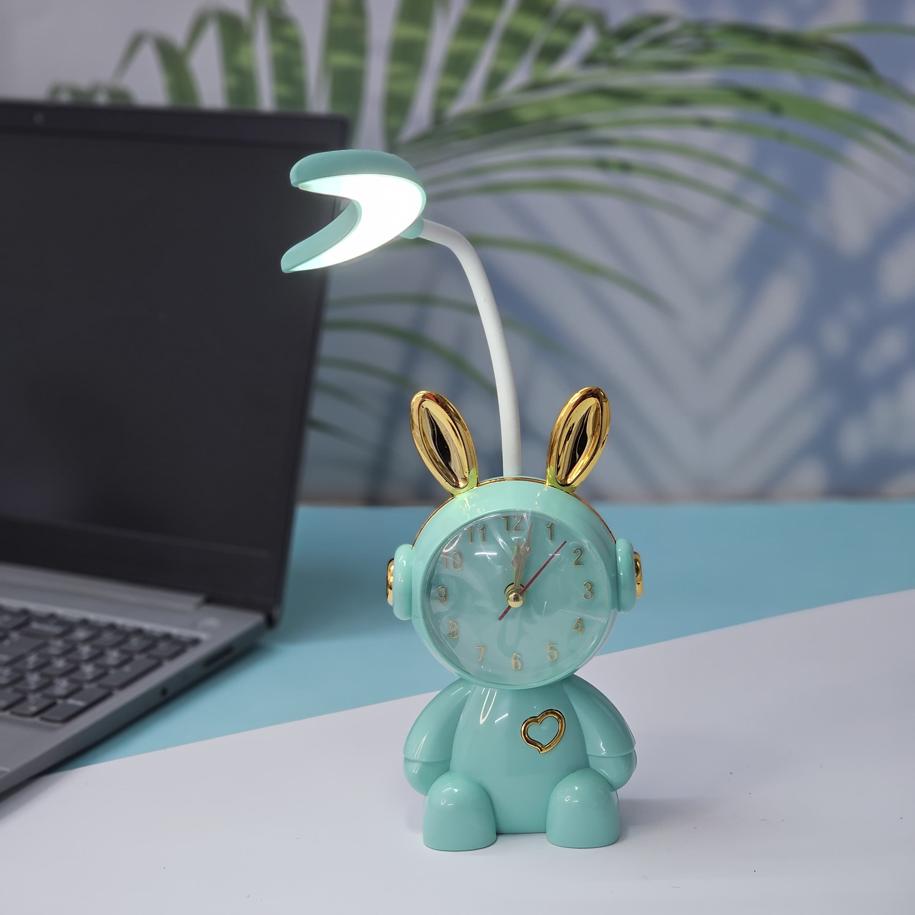 Buy the Usmile Toys adorable pink bunny clock with moon night light for your child's room. This fun alarm clock and soft lamp helps create a soothing bedtime routine." www.usmile.toys