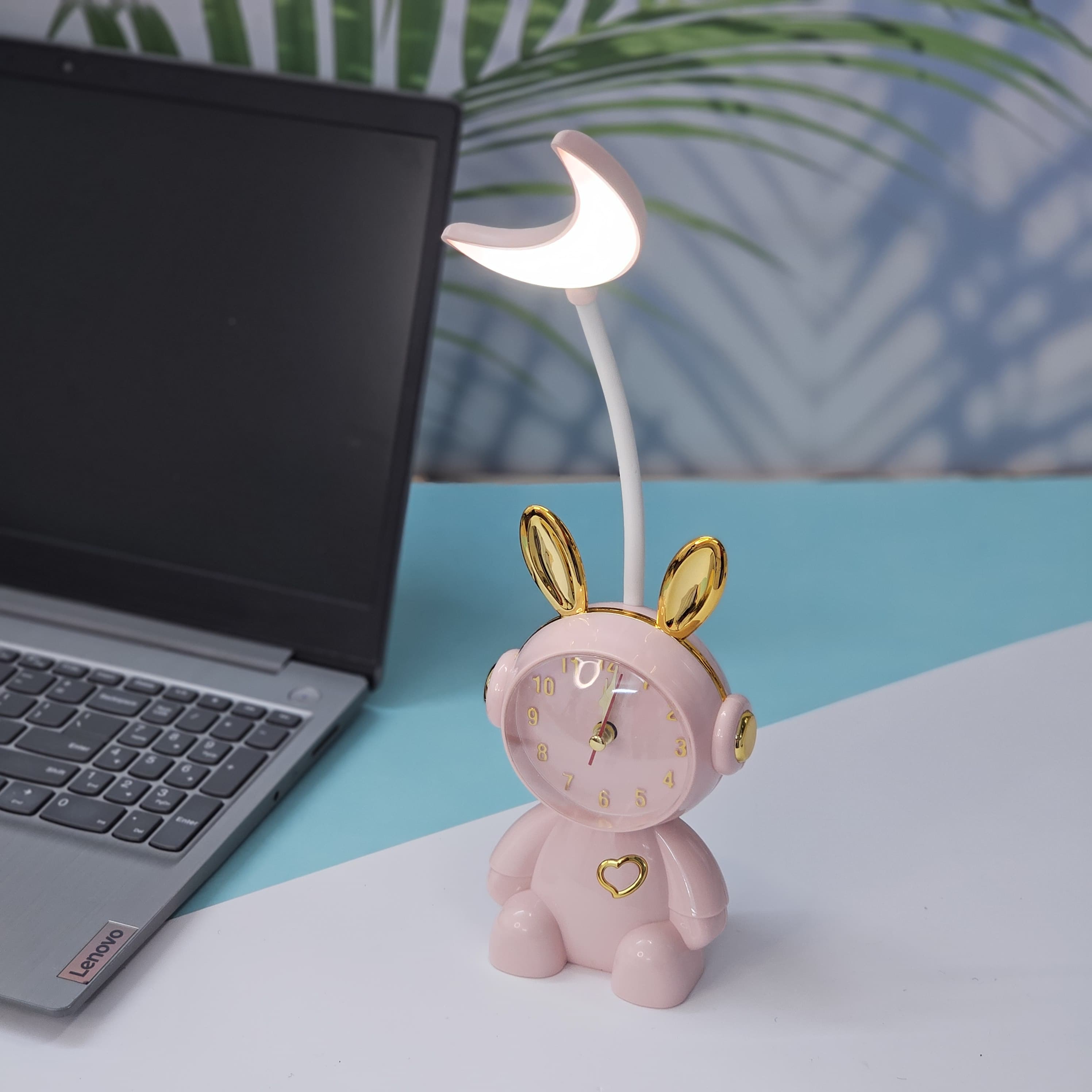 Buy the Usmile Toys adorable pink bunny clock with moon night light for your child's room. This fun alarm clock and soft lamp helps create a soothing bedtime routine." www.usmile.toys