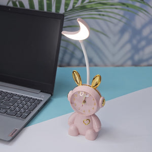 Buy the Usmile Toys adorable pink bunny clock with moon night light for your child's room. This fun alarm clock and soft lamp helps create a soothing bedtime routine." www.usmile.toys