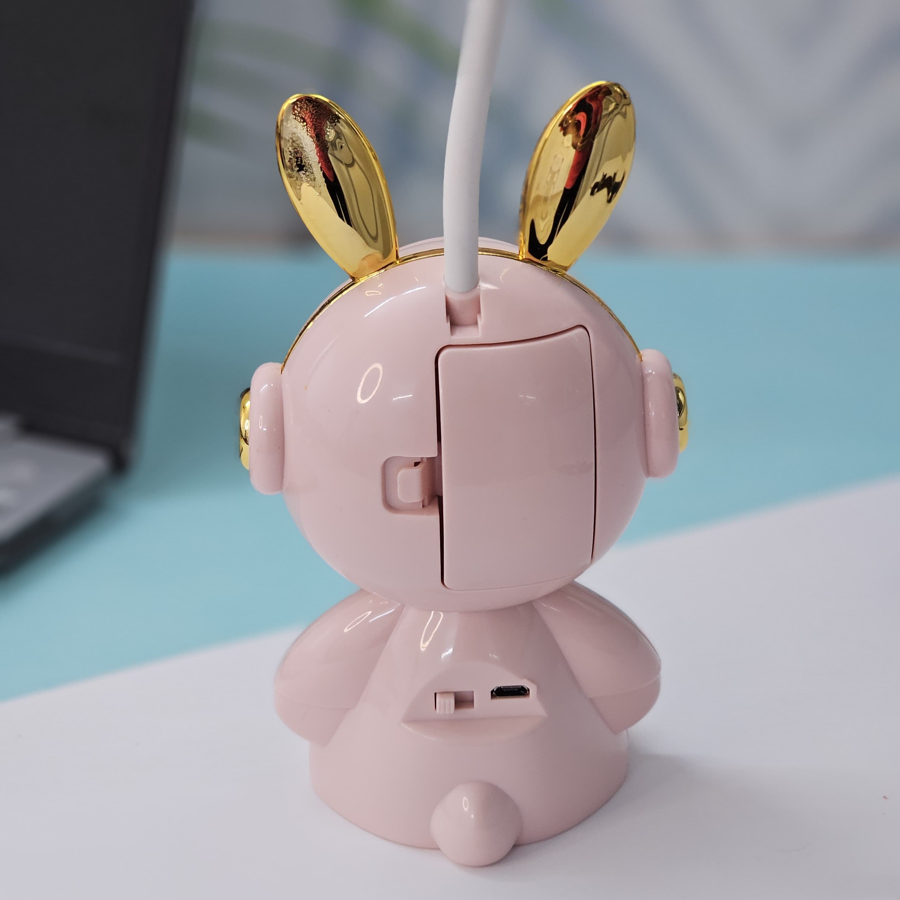 Buy the Usmile Toys adorable pink bunny clock with moon night light for your child's room. This fun alarm clock and soft lamp helps create a soothing bedtime routine." www.usmile.toys