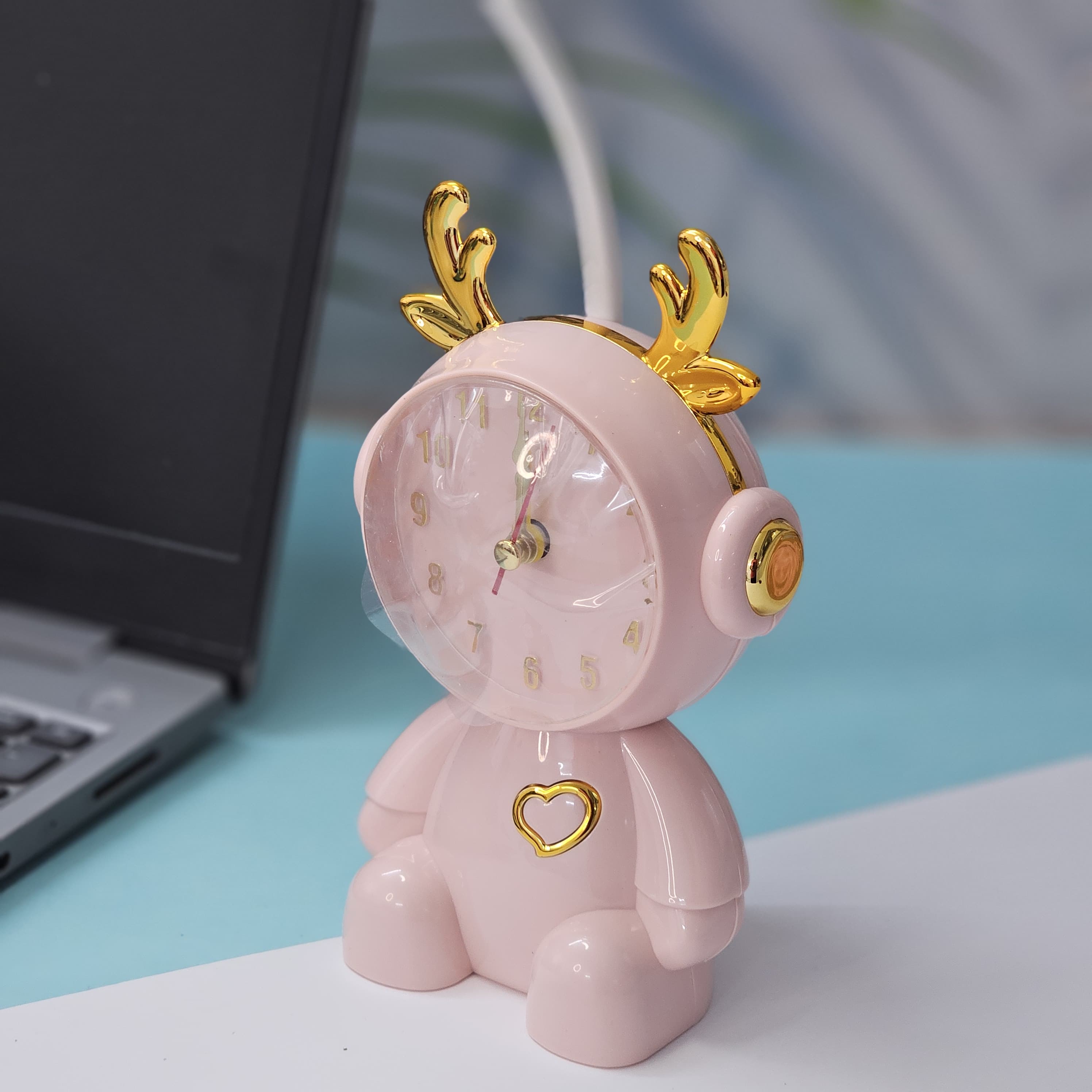 Buy the Usmile Toys adorable pink bunny clock with moon night light for your child's room. This fun alarm clock and soft lamp helps create a soothing bedtime routine." www.usmile.toys