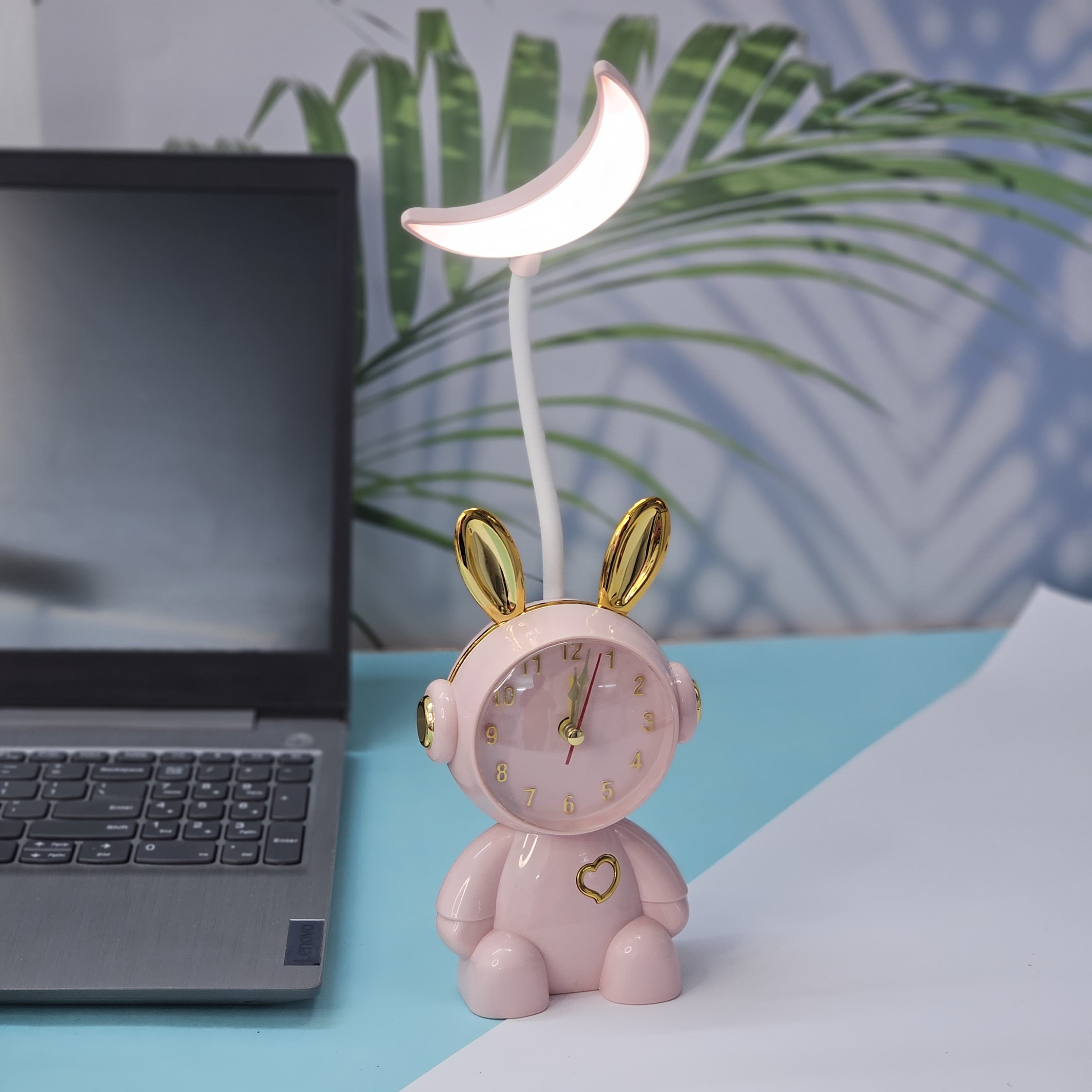Buy the Usmile Toys adorable pink bunny clock with moon night light for your child's room. This fun alarm clock and soft lamp helps create a soothing bedtime routine." www.usmile.toys