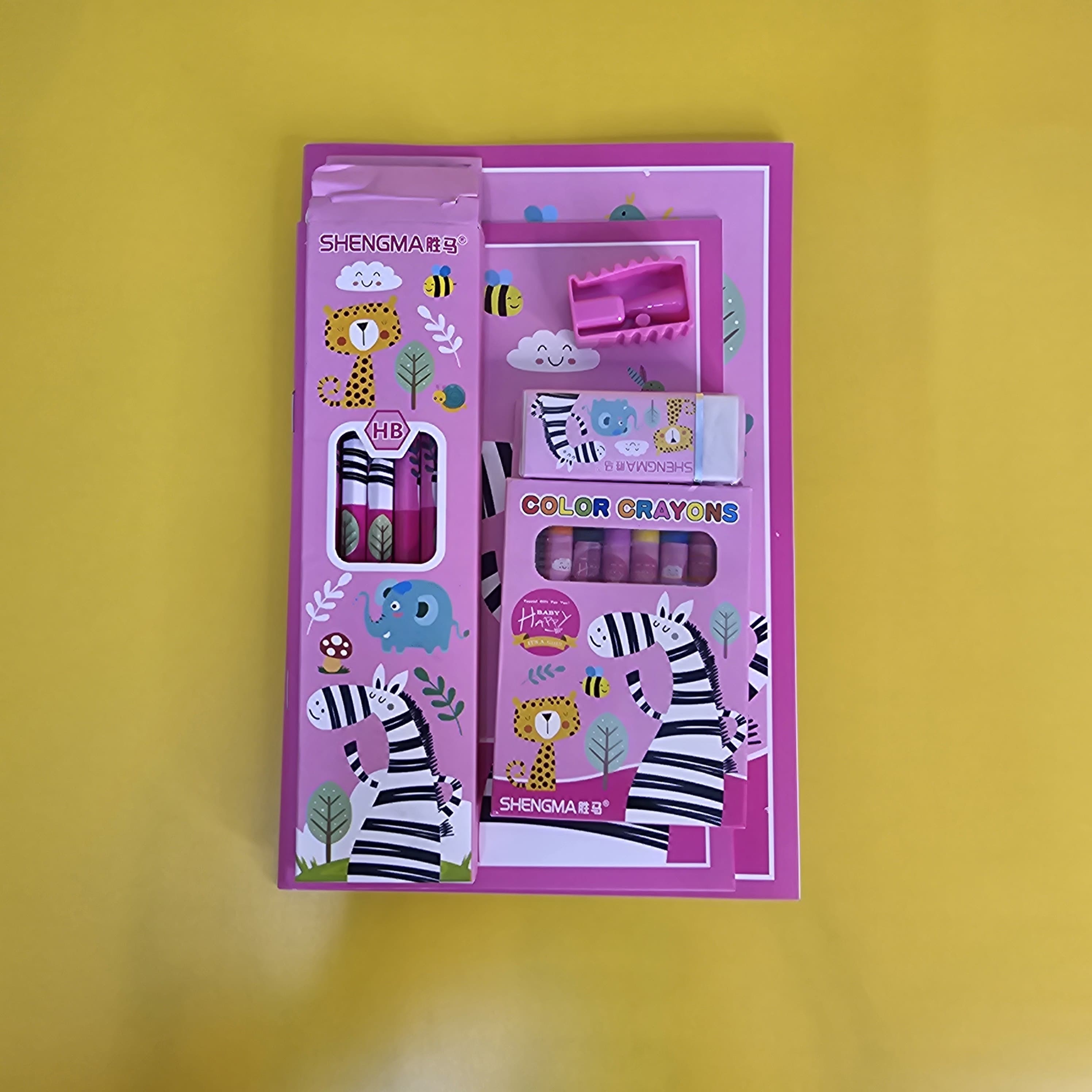 Engaging animal-themed stationery kit for young learners, including notebooks, HB pencils, eraser, sharpener, and 8 colour crayons, available in www.usmile.toys
