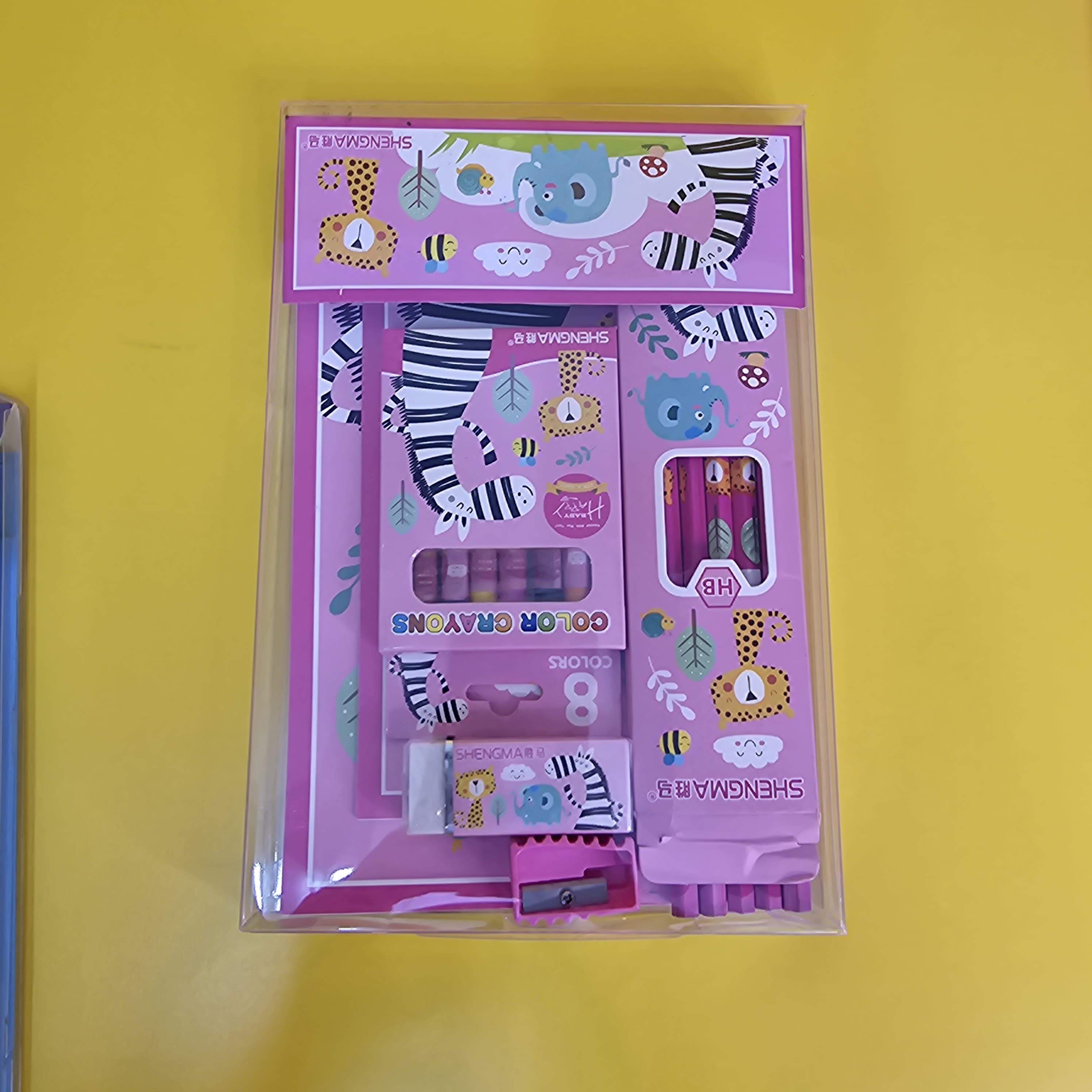 Engaging animal-themed stationery kit for young learners, including notebooks, HB pencils, eraser, sharpener, and 8 colour crayons, available in www.usmile.toys

