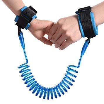 Blue anti-lost wrist safety strap connecting an adult's hand to a child's hand, featuring comfortable wrist cuffs and a coiled wire, designed for keeping toddlers and kids safe in public, available from Usmile Toys www.usmile.toys