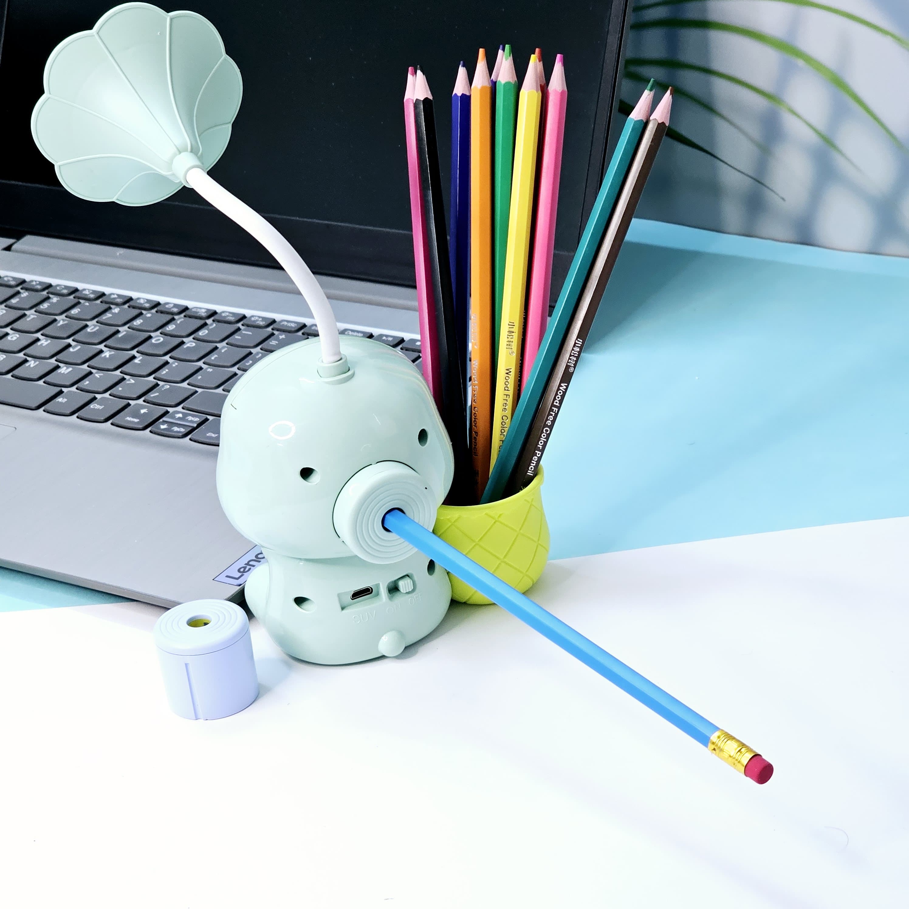 Set of three Usmile Toys Astronaut Teddy Lamps in blue, pink, and green, each featuring a glowing flower-shaped light and a base designed as a convenient pencil holder.