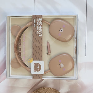 BuBu Bear wired headphones for kids, featuring a cute rabbit design in soft pink, with a detachable microphone and a visible audio jack, displayed on a white surface with floral decorations, highlighting the product's features and aesthetic appeal."              www.usmile.toys