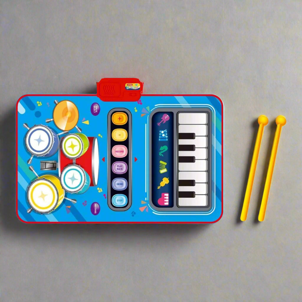 Vibrant blue baby piano mat with drum pads, keyboard, and yellow drumsticks, an early learning musical toy by Usmile Toys." www.usmile.toys