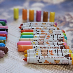 Watercolor pens with BuBu Friends characters, 24 vibrant and washable colors, arranged in rows on a surface.                 www.usmile.toys