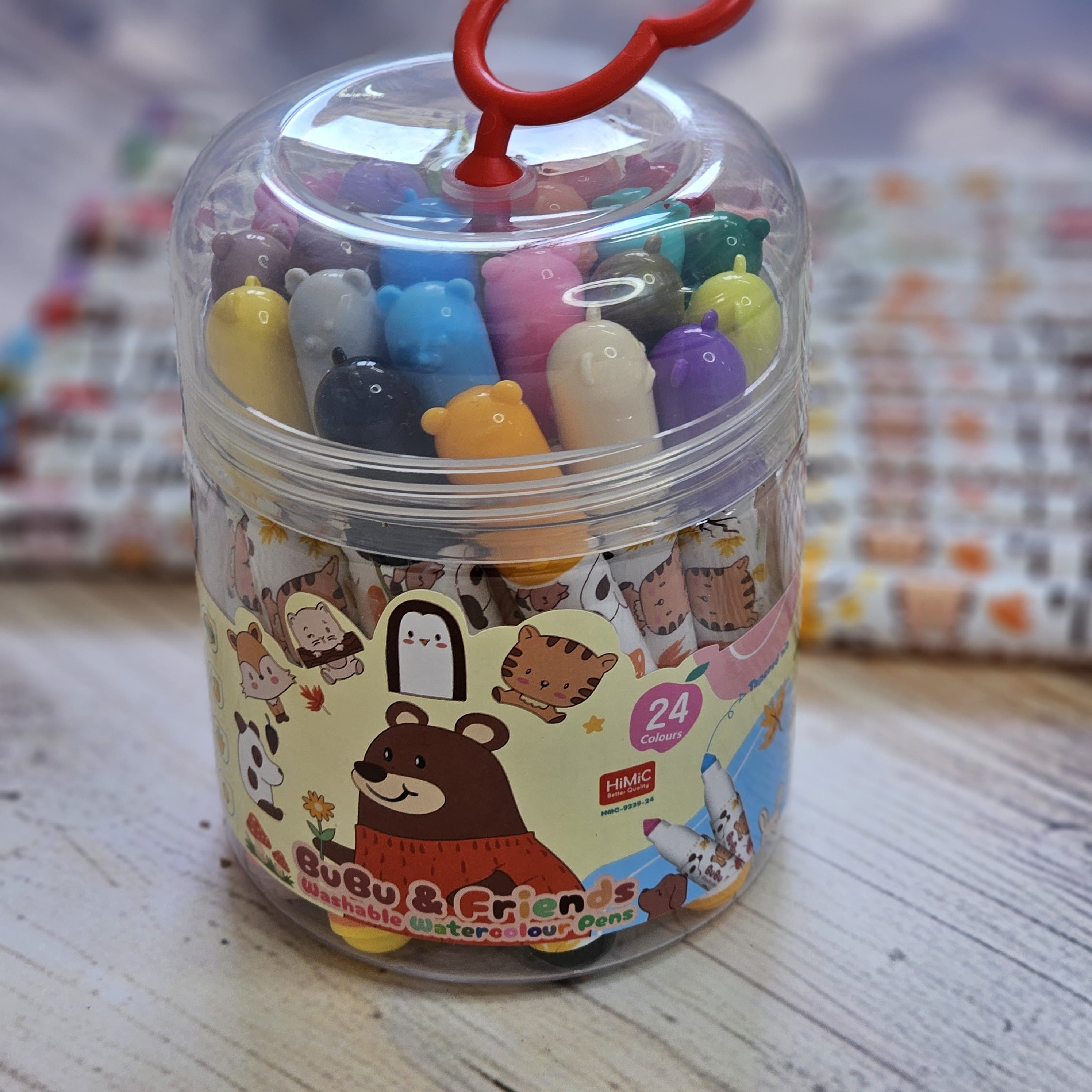 Watercolor pens with BuBu Friends characters, 24 vibrant and washable colors, arranged in rows on a surface. www.usmile.toys