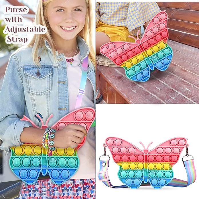 Front view of a Usmile Toys girls' crossbody purse, shaped like a rainbow butterfly Pop It fidget toy, with a striped strap and accompanying accessories." www.usmile.toys