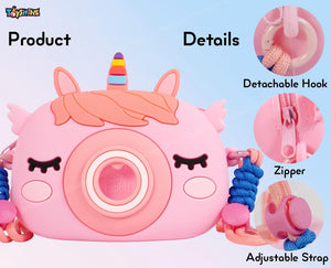 "Usmile Toys Kids' pink camera-shaped silicone bag featuring a unicorn horn and ears, displayed with matching unicorn comb and keychains." www.usmile.toys