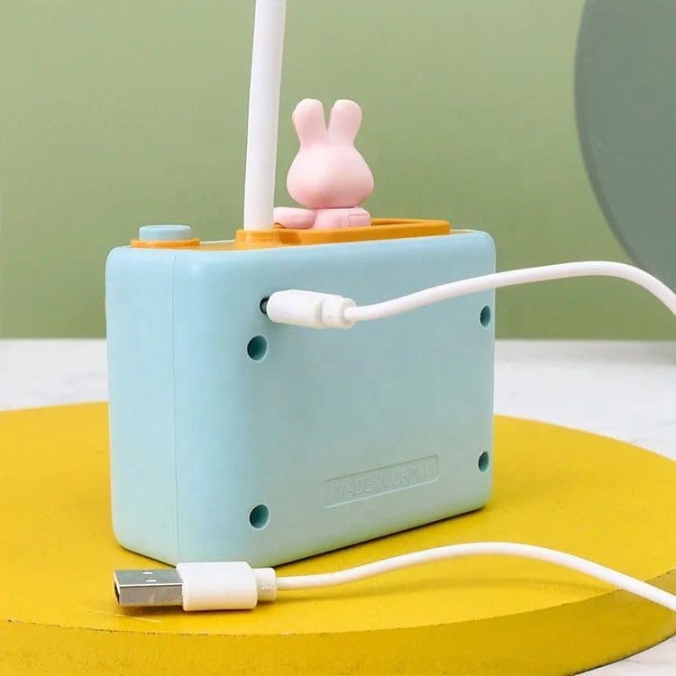Two cute camera-shaped study desk LED lamps for kids, one peach and one light blue, each featuring a pencil holder and a built-in pencil sharpener. Ideal for reading and organizing stationery from uSmile.toys." www.usmile.toys