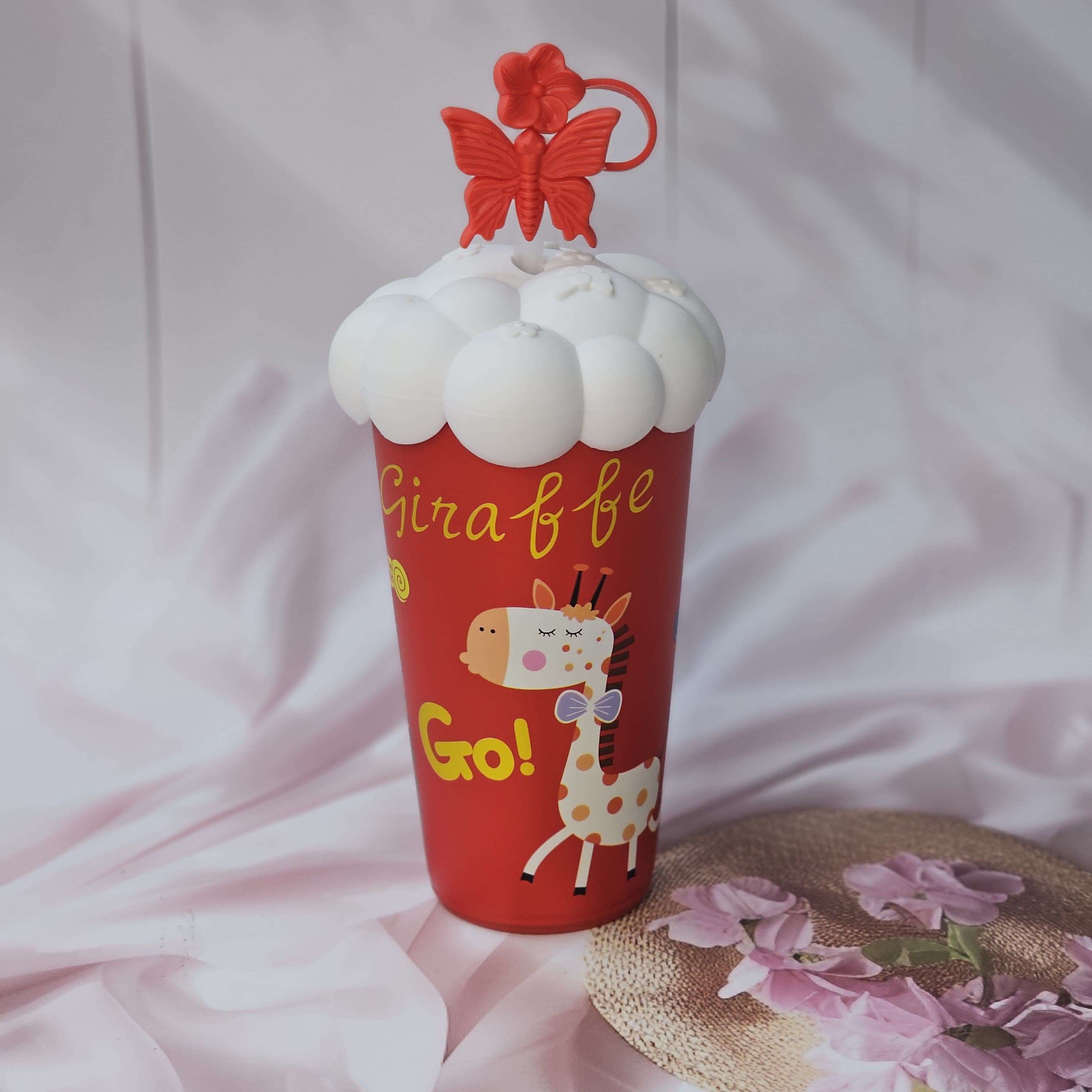 Usmile Toys 'Fun & Functional' kids' drinkware: a mix of insulated cartoon tumblers in blue, green, pink, red, and purple, featuring a pug, donut, bunny, giraffe, and girl design respectively, all with white cloud lids." www.usmile.toys