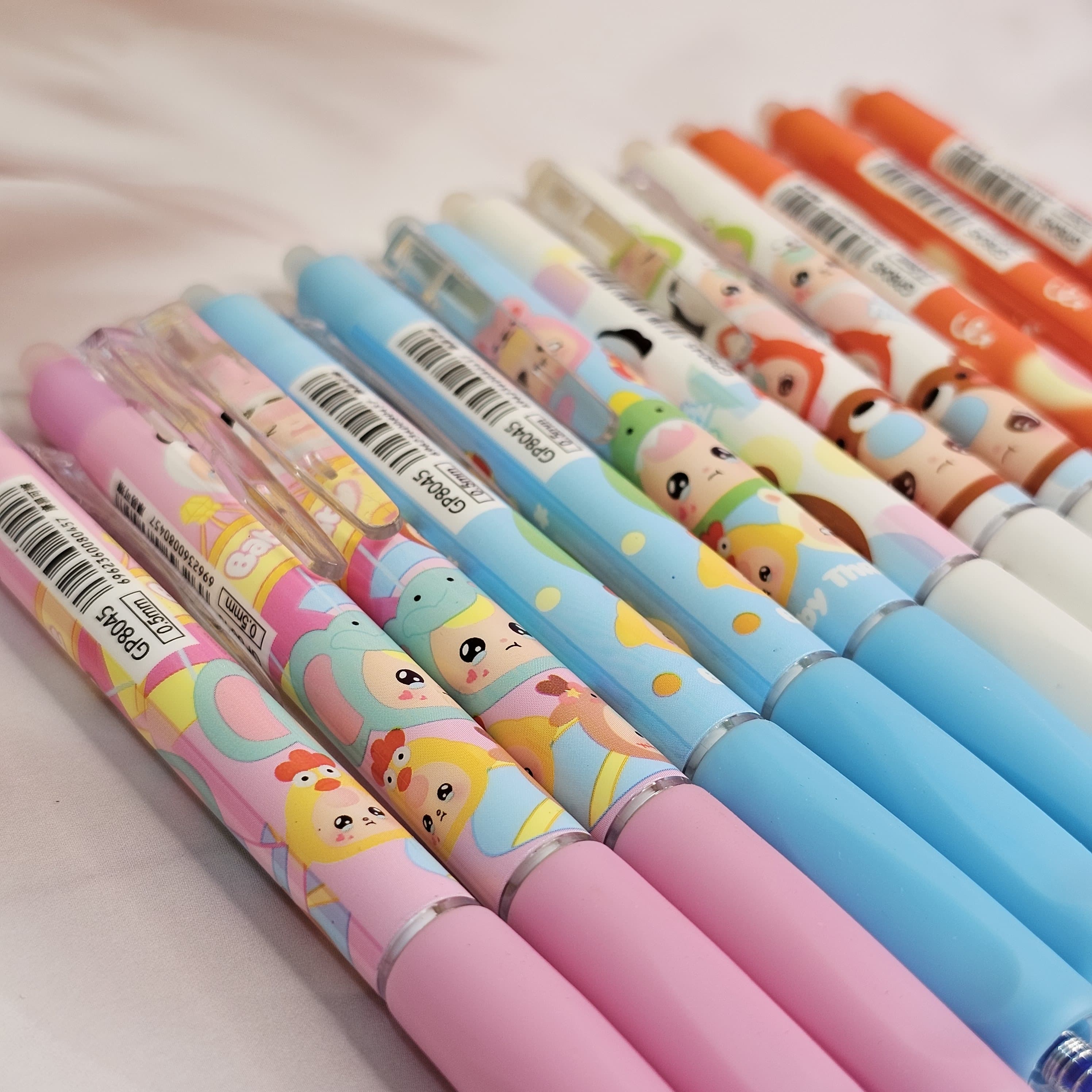 Set of colourful cartoon print erasable pens for kids with a magic eraser tip, offering smooth writing for school www.usmile.toys
