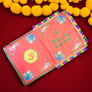 Decorative book with colorful designs on a red background