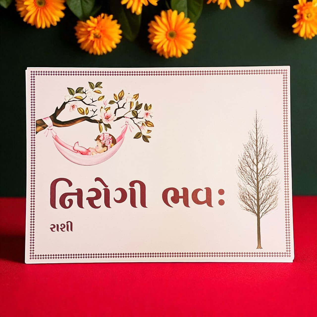 Card with floral design and text on a red background