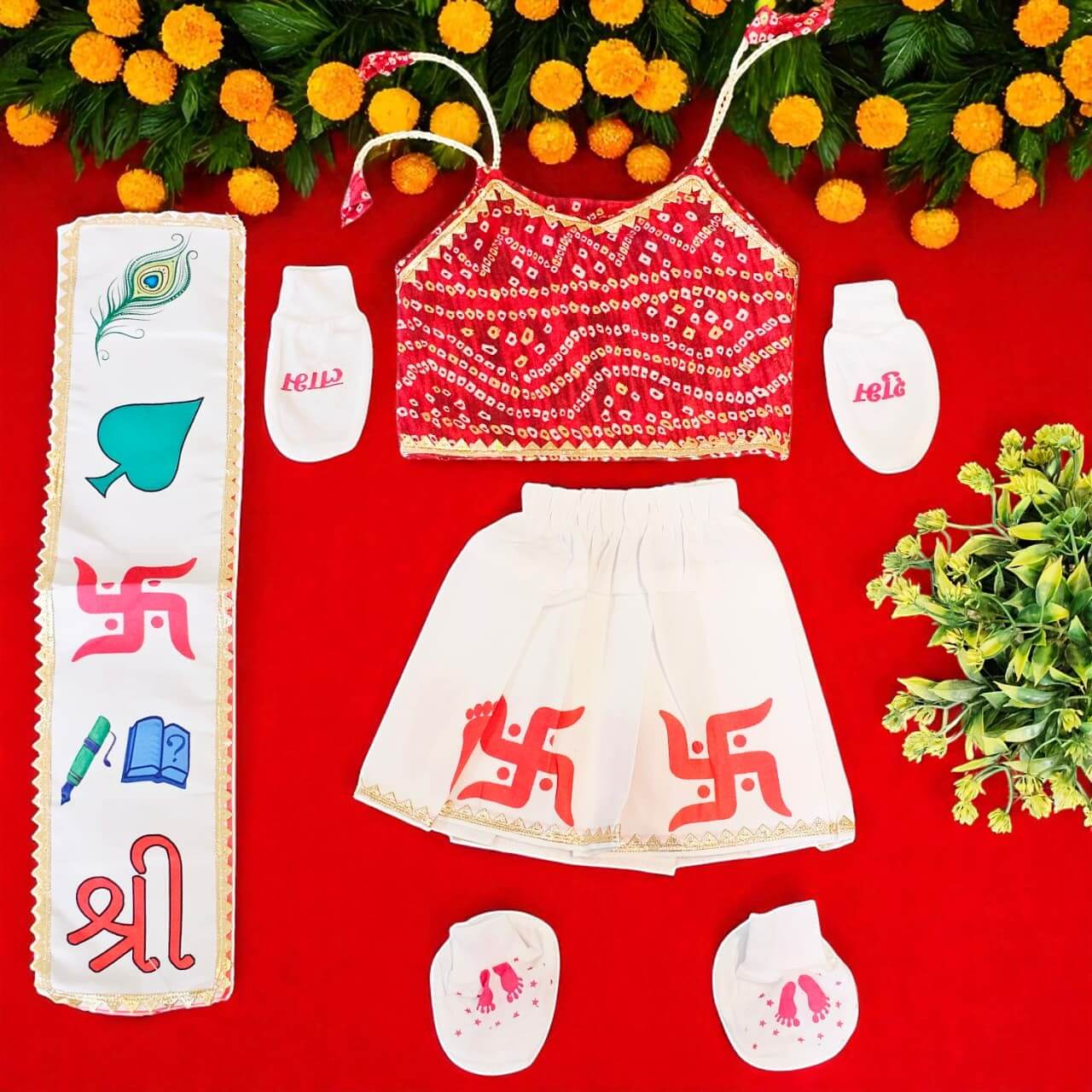 Children's outfit with top, skirt, and shoes on a red background with flowers.