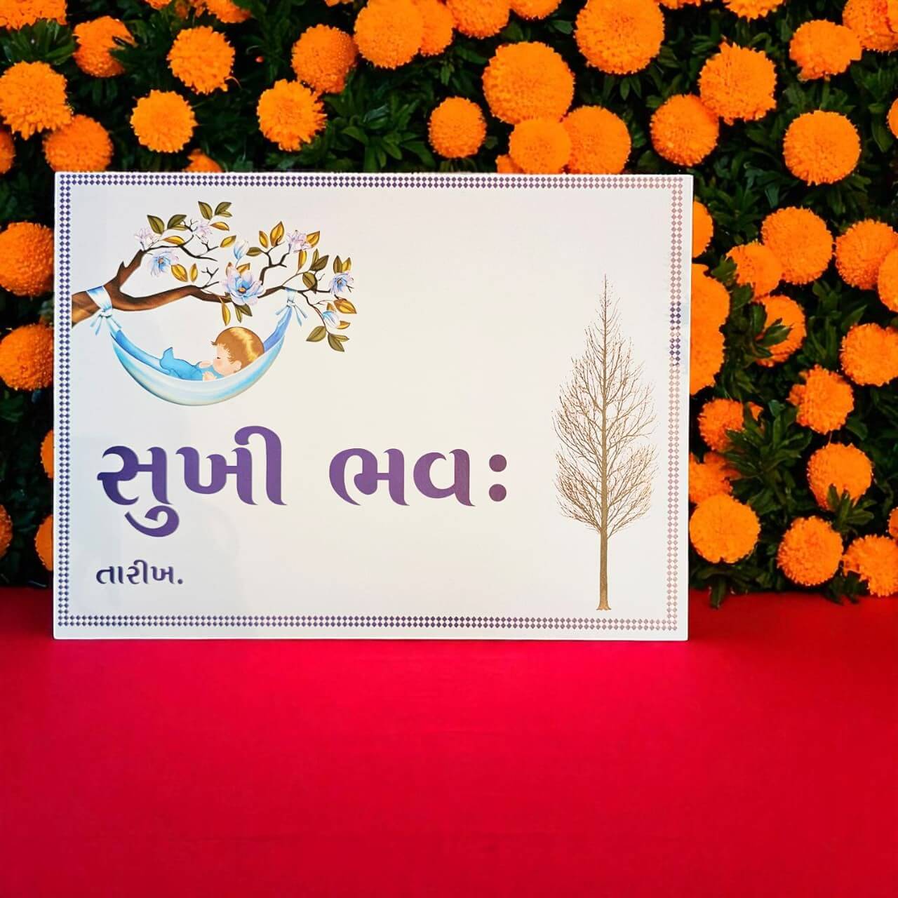 White card with tree design and text on a red background with orange flowers