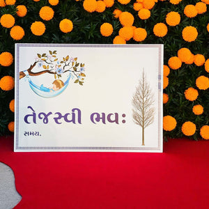 White card with tree illustration and text on a red surface with orange flowers