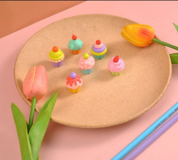 Cupcake erasers with various colors and toppings, packaged in a decorative blister pack  www.usmile.toys