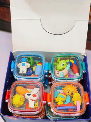Fun, colorful erasers in animal and space shapes, packaged in small, square bento boxes. www.usmile.toys