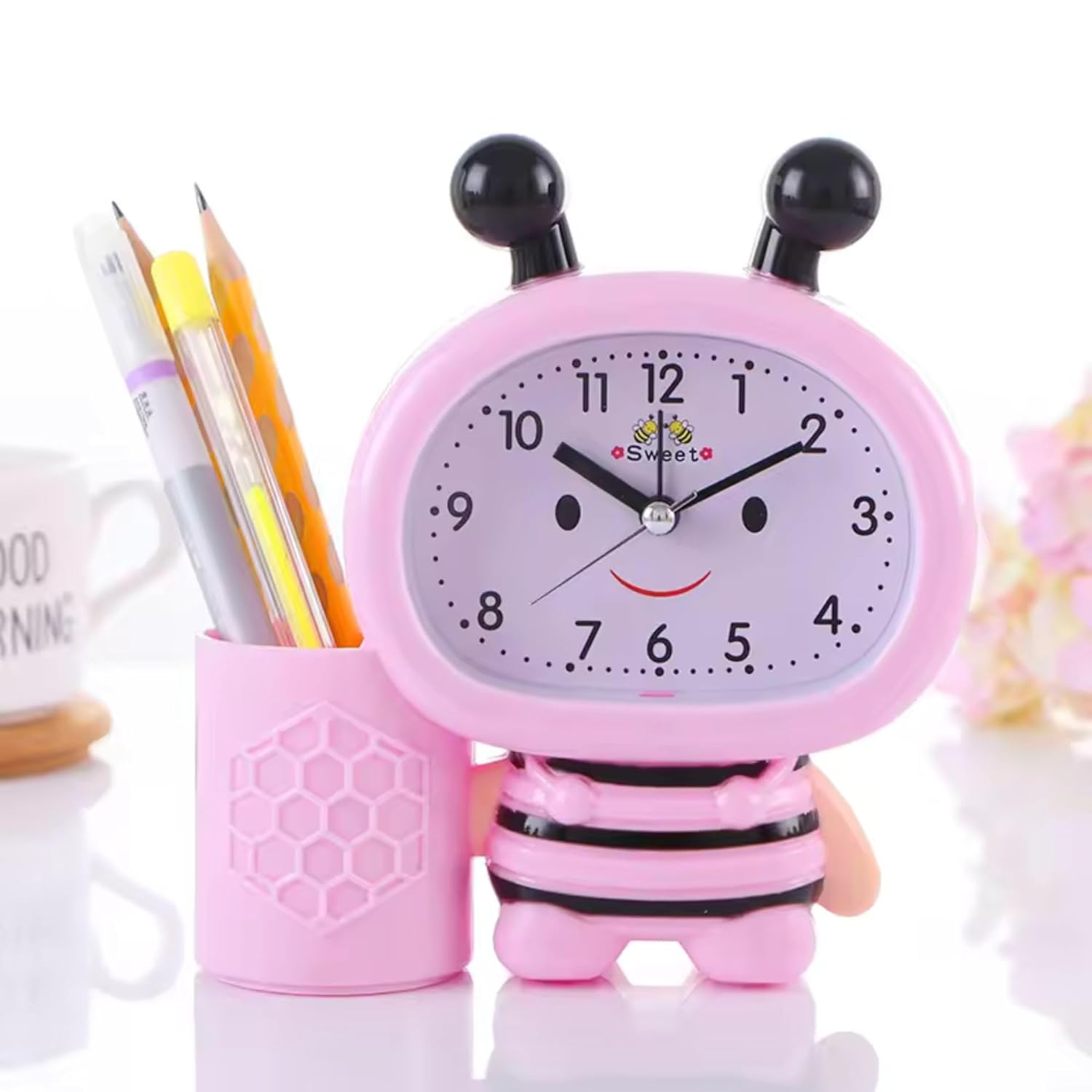 Cute Bee Shaped Alarm Clock: Includes a pen cup for stationery. Fun and practical desk accessory.
www.usmile.toys