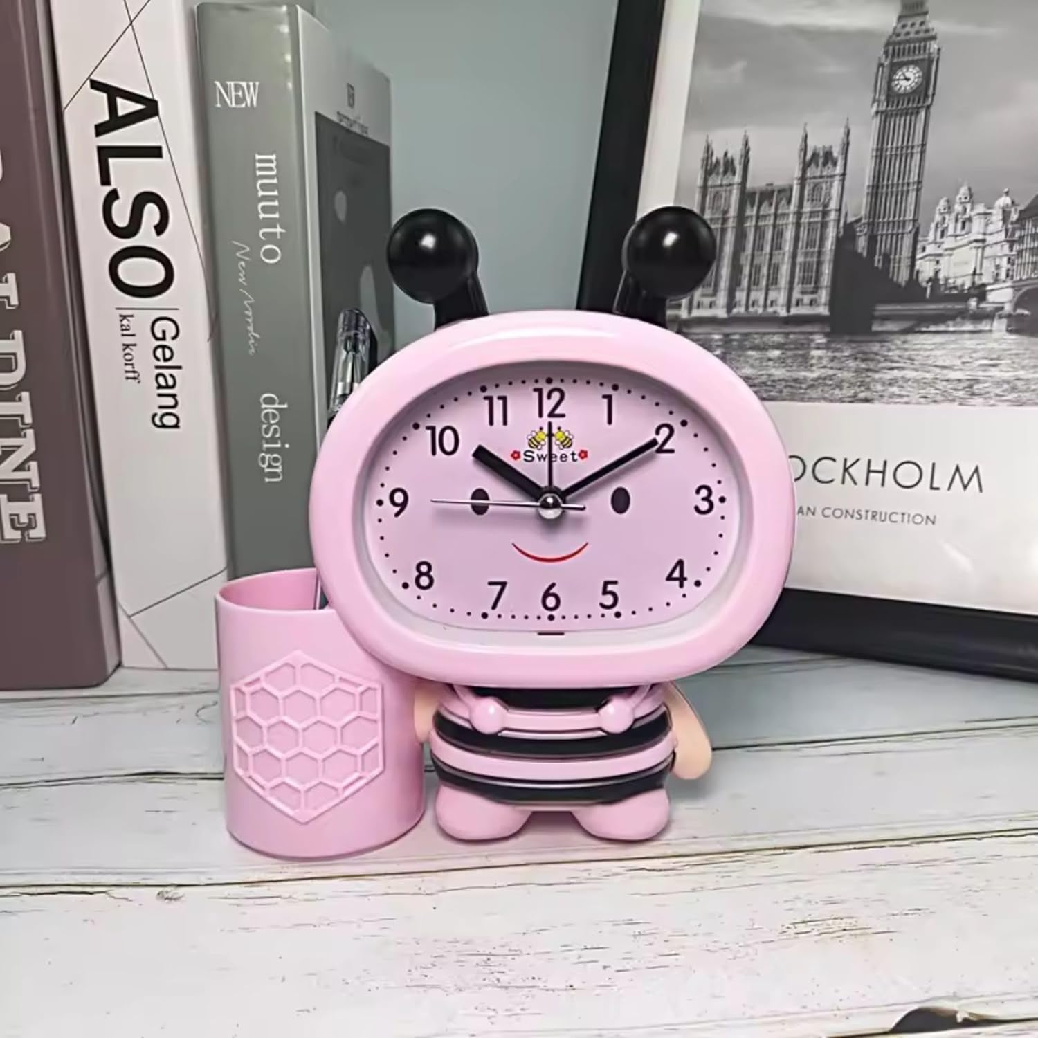 Bee Alarm Clock with Pen Holder: Cute cartoon bee design for desks. Functional and adorable timekeeping.
www.usmile.toys
