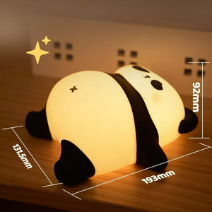 Provide a gentle, comforting glow with this sweet silicone night lamp featuring a cute lying panda design, perfect for kids' rooms and helping with bedtime. Find it at uSmile.toys." www.usmile.toys