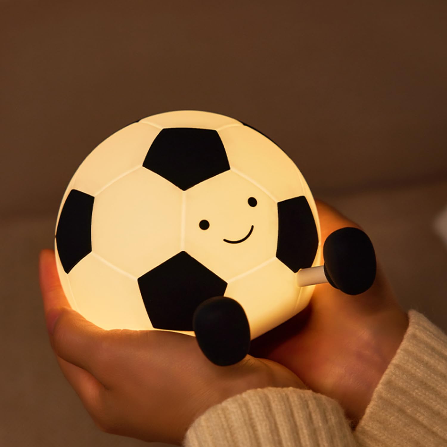 Score big on bedtime comfort with this fun football-shaped silicone night light, perfect for kids who love sports. Provides a soft, comforting glow for sweet dreams. Find it at uSmile.toys." www.usmile.toys