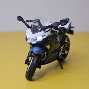 green and black toy motorbike, a die-cast model designed for kids with fun pull-back action and interactive LED lights, available at Usmile Toys.